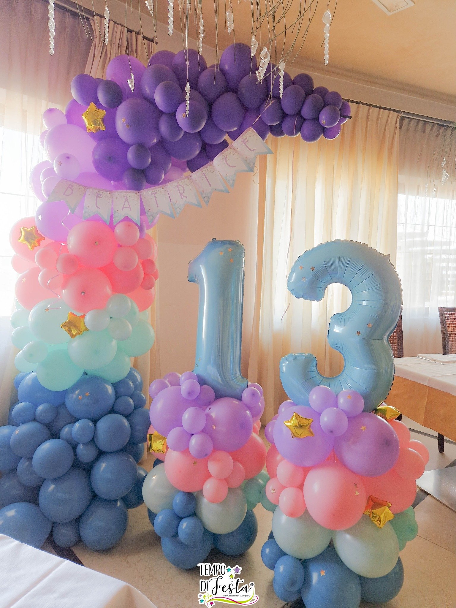 Arco orgánico de globos en tonos pastel